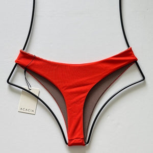 Acacia Swimwear Brazil ribbed bikini bottom persimmon orange – flat lay back view