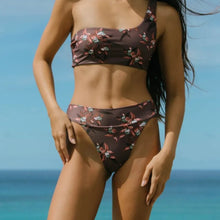 Model wearing the Acacia Mateo bikini bottom in Ren, showing high-leg fit at the beach.