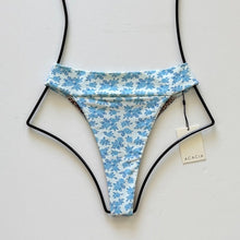 Flat lay of Acacia Swimwear Mateo Bikini Bottom in Petite Rose with ivory base and petite blue rose floral print, size Large.