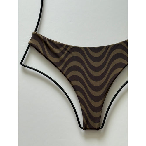 Close-up fabric detail of Jane wavy brown print swim fabric.