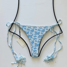 Acacia Swimwear Lauie bikini bottom in Petite Rose floral print, cheeky cut with tassel side ties shown.