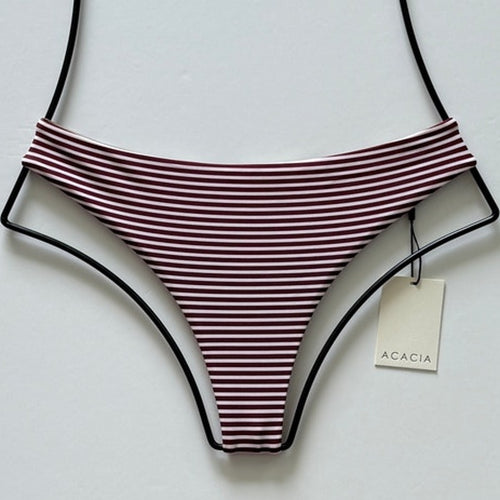 Flat lay of Acacia Swimwear Brazil bottom Carolina print with tag attached.
