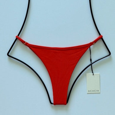 Flat lay of Acacia Swimwear Neema Ribbed Bikini Bottom in Persimmon orange, size Medium, front view.