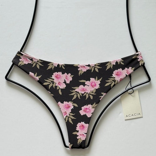 Front flat lay of Acacia Swimwear Brazil Bikini Bottom in Floret print with pink flowers on a deep chocolate brown base.