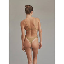 Back view of model wearing Acacia Oslo Palm bikini bottom, showing high-leg fit and seamless finish.