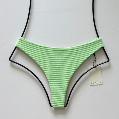 Flat lay of Acacia Swimwear Brazil Terry Ribbed Bikini Bottom in Naupaka green, size medium.