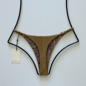 Back view flat lay showing dual print with ribbed front and subtle leopard-print lining.