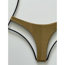 Close-up of ribbed fabric texture on Acacia Swimwear Palm Oslo bikini bottom.