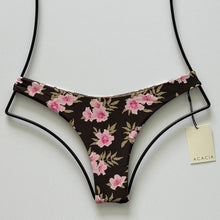 Front flat lay of Acacia Swimwear Oslo Bikini Bottom in Floret print featuring brown base with pink floral pattern.
