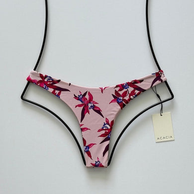 Front flat lay of Acacia Oslo Bikini Bottom in Mokoli‘i featuring blush base and tropical orchid floral print.