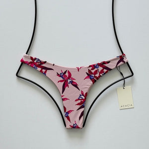 Front flat lay of Acacia Oslo Bikini Bottom in Mokoli‘i featuring blush base and tropical orchid floral print.
