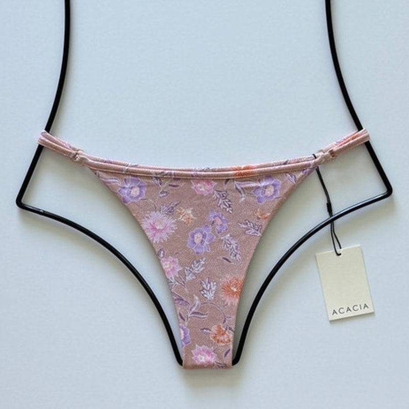 Acacia Swimwear Neema Bikini Bottom in Dahlai – dusty rose with lavender and blush floral print, front view, size large.
