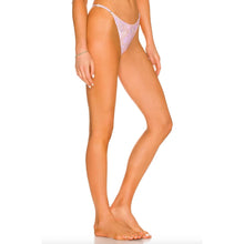 Side angle of Acacia Swimwear Neema Bikini Bottom Dahlai print, high-cut silhouette elongating legs