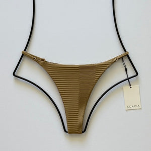 Front flat lay of Acacia Swimwear Ralphy Dual Ribbed Bikini Bottom in Palm – ribbed olive-brown fabric with side straps and Acacia tag visible.