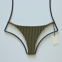 “Acacia Swimwear Ralphy bikini bottom in Hinahina – olive green with vertical white pinstripes, minimal coverage high-cut design.