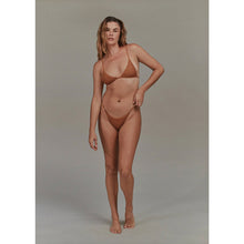 Stock photo – model wearing Acacia Swimwear Neema Crochet Bikini Bottom in similar style, front view to show fit.