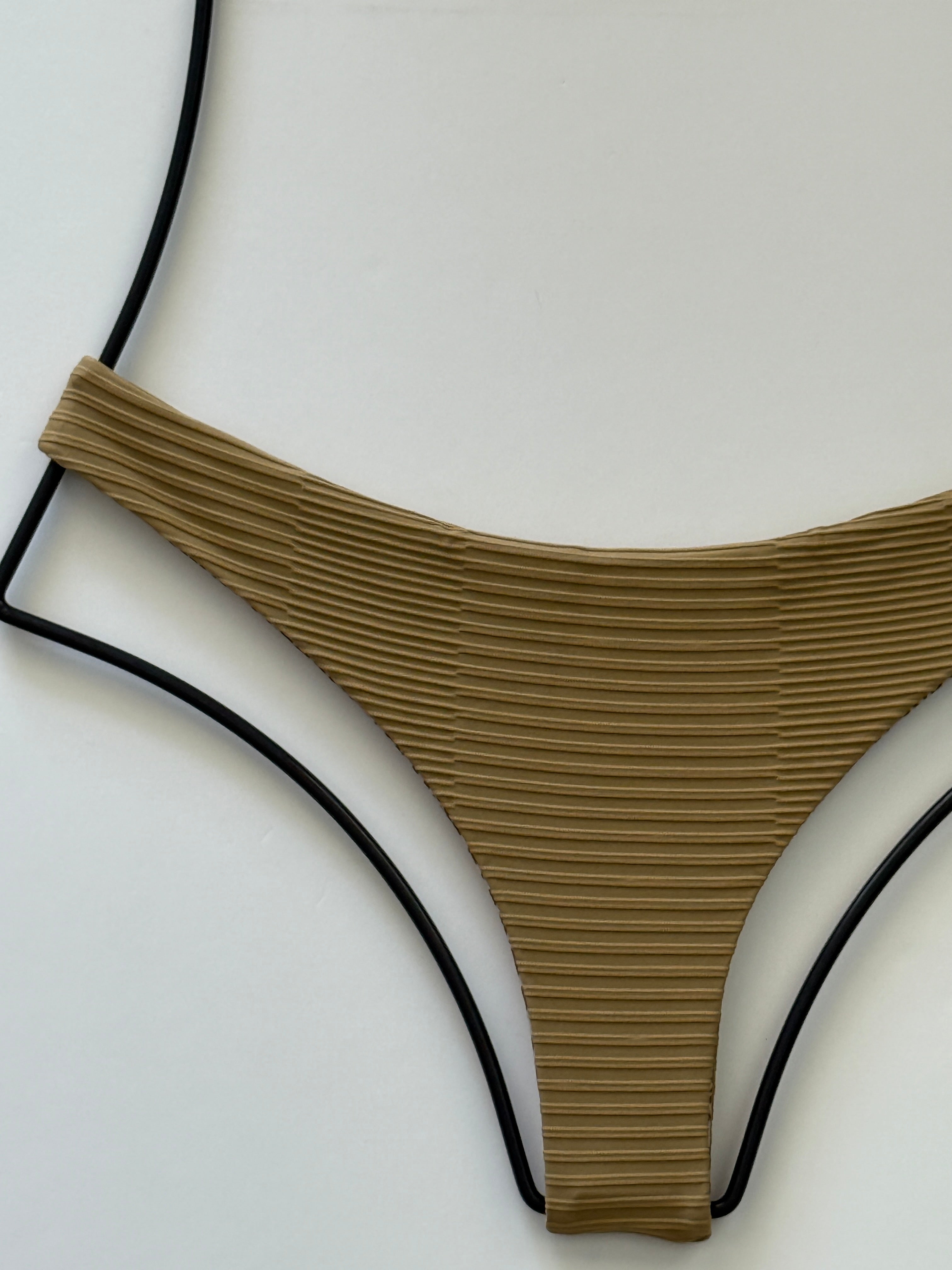 Acacia Swimwear Palm ribbed bikini bottom flat lay with tag – eco friendly recycled nylon