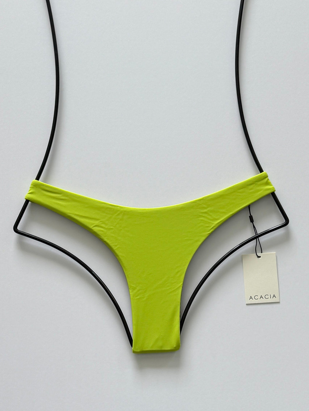 Front flat lay of Acacia Swimwear Oslo Bikini Bottom in Wasabi green, featuring cheeky cut and high-leg design.
