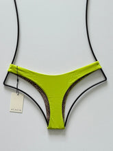Back flat lay of Acacia Oslo Wasabi green bikini bottom showing minimal coverage and seamless finish.