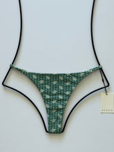 Front flat lay of Acacia Swimwear Ralphy Bikini Bottom in Punahele green floral print with adjustable straps.
