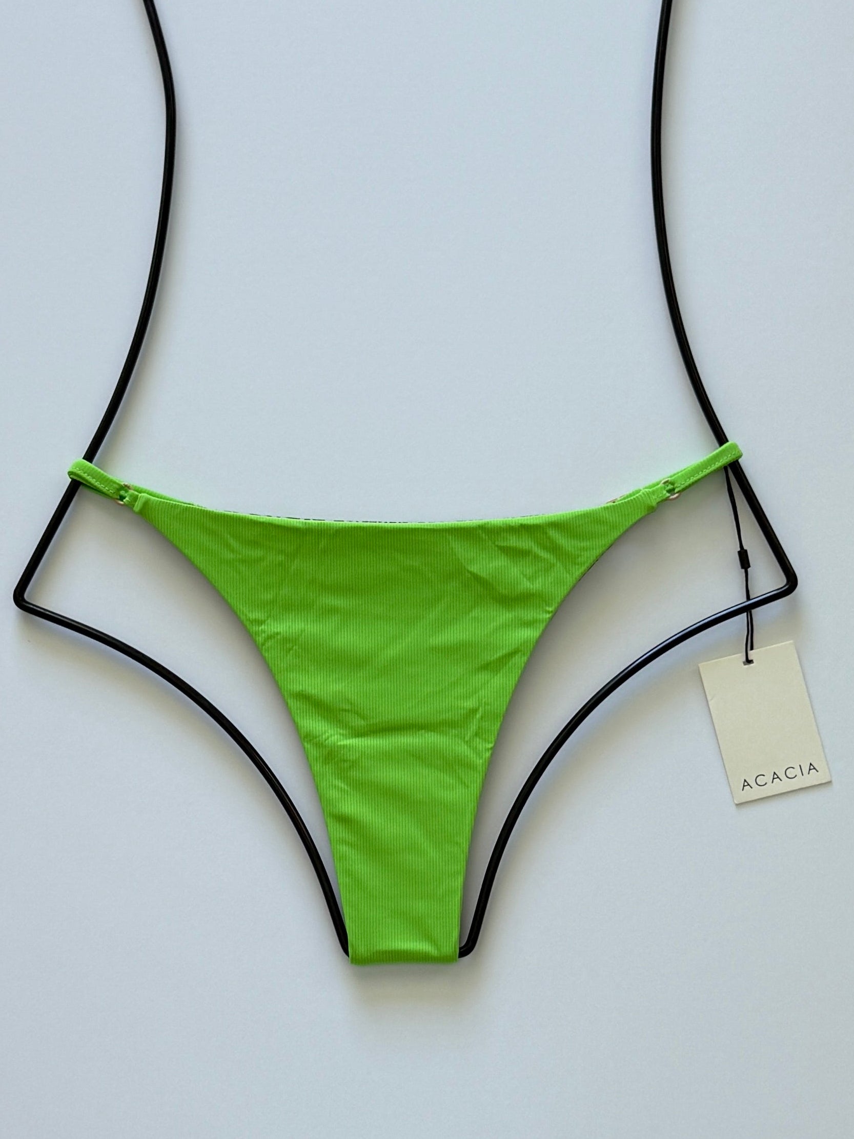 Front flat lay of Acacia Swimwear Ralphy Ribbed Bikini Bottom in Matcha green with adjustable side straps.
