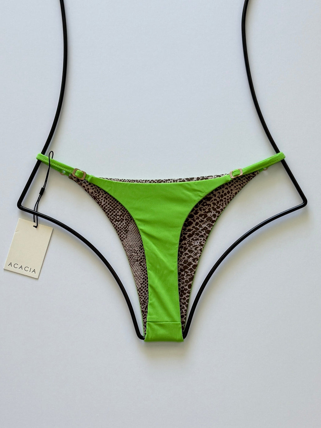 Back view of Acacia Ralphy Ribbed Bikini Bottom showing printed reverse and high-cut silhouette.