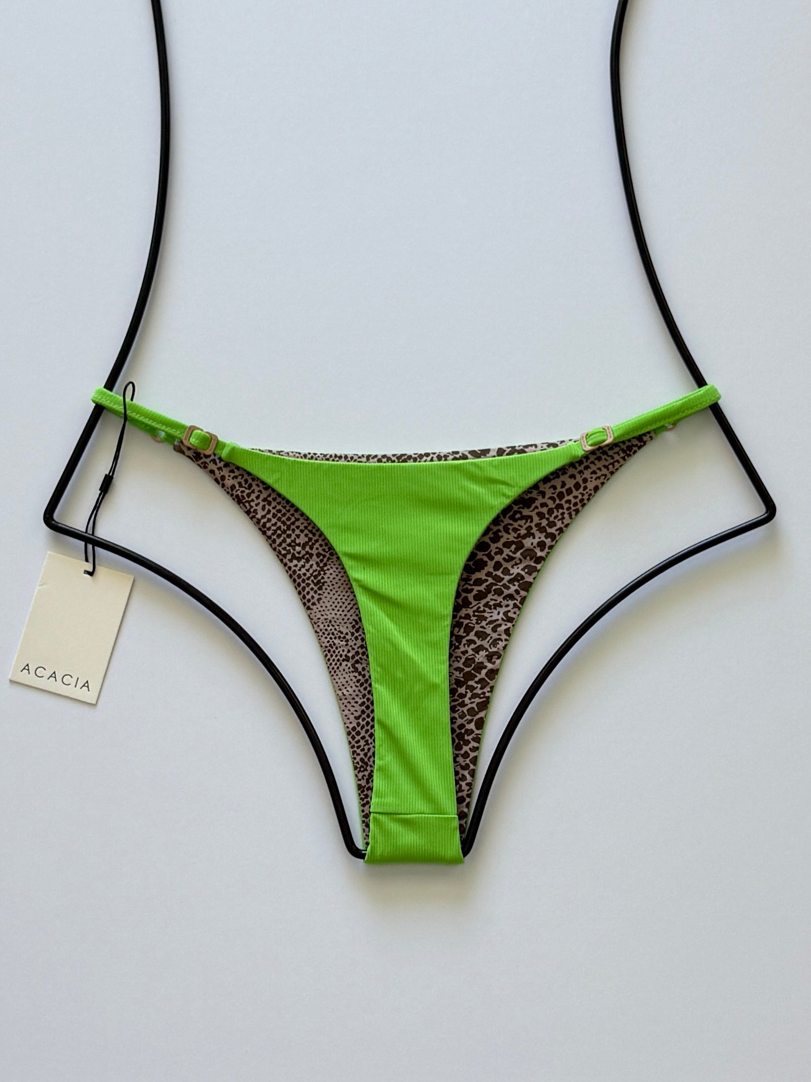 Back view of Acacia Ralphy Ribbed Bikini Bottom showing printed reverse and high-cut silhouette.