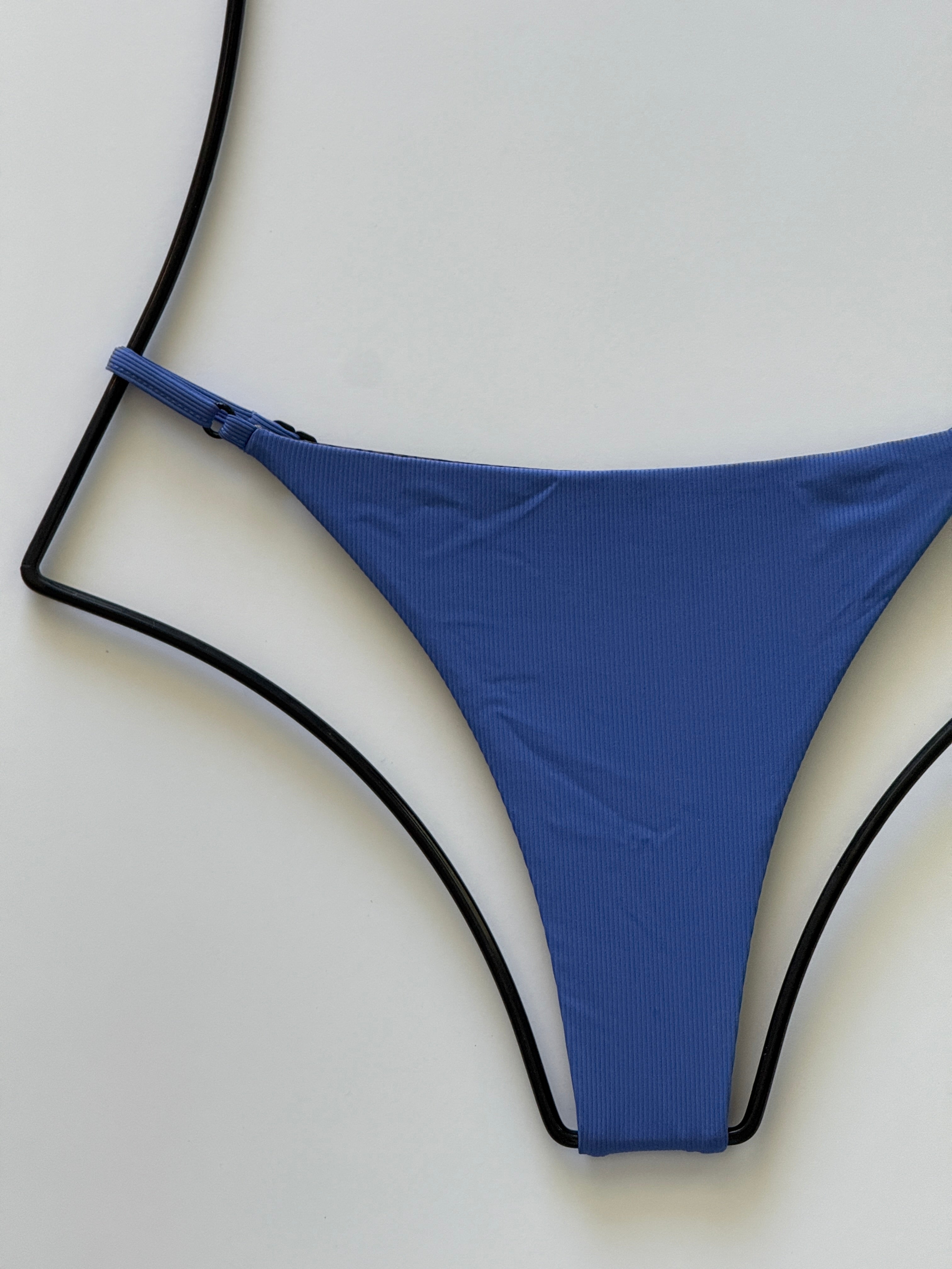 Close-up of ribbed Sapphire blue fabric texture on Acacia Ralphy Bikini Bottom.