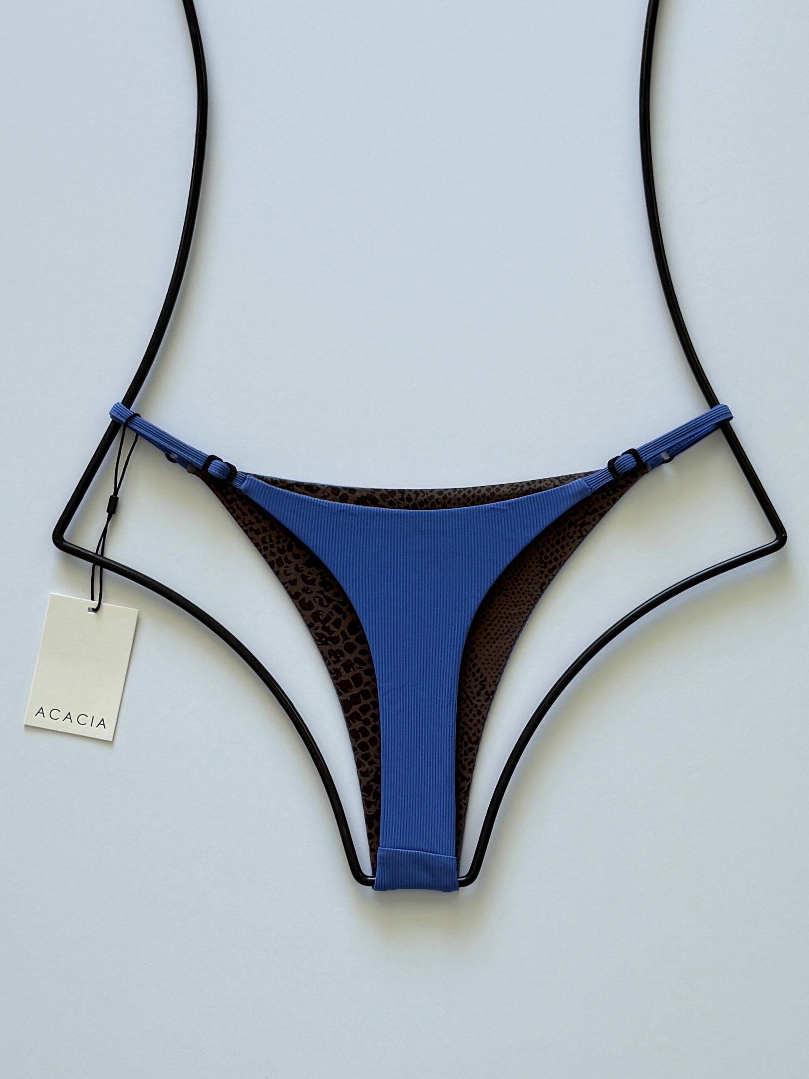 Back view of Acacia Ralphy Ribbed Bikini Bottom showing printed reverse and high-cut silhouette.