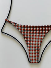 Close-up of Acacia Ralphy Bikini Bottom fabric showing geometric star pattern detail.”