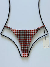 Front flat lay of Acacia Swimwear Ralphy Bikini Bottom in Sidi, terracotta and cream geometric print with adjustable straps.