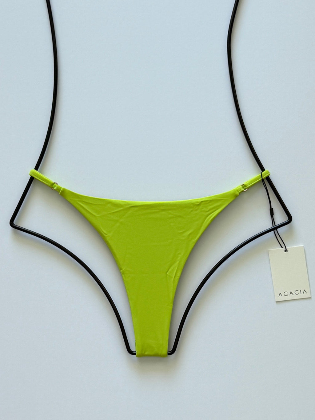 Front flat lay of Acacia Swimwear Ralphy Bikini Bottom in Wasabi, bright lime-green color with adjustable side straps.