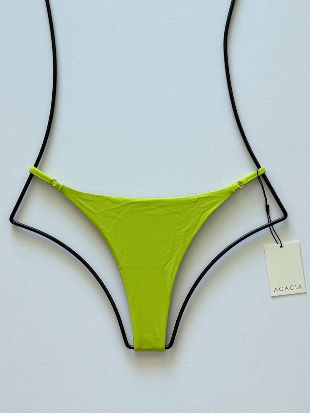 Front flat lay of Acacia Swimwear Ralphy Bikini Bottom in Wasabi, bright lime-green color with adjustable side straps.