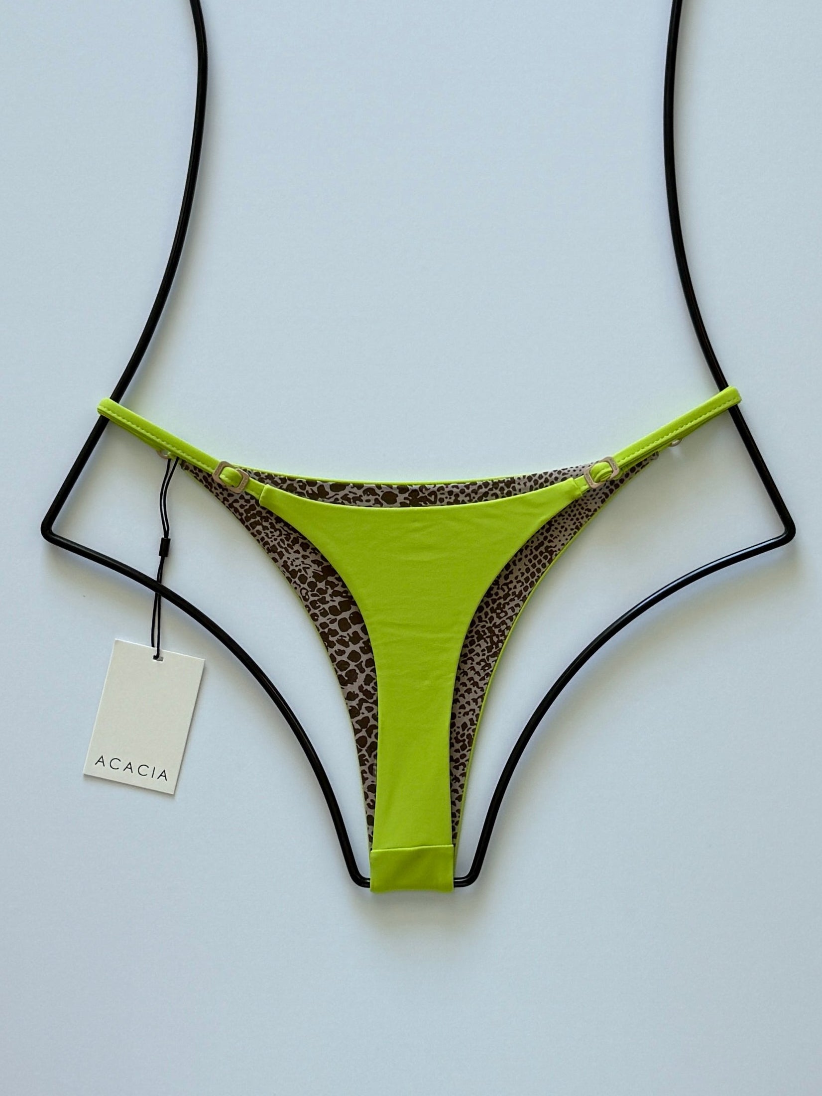 Back view of Acacia Ralphy Bikini Bottom featuring contrast taupe and brown animal print with high-cut design.