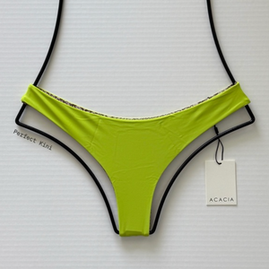 Front view of ACACIA Swimwear Ho‘okipa Bikini Bottom in Wasabi green, low-rise cheeky Brazilian cut, skimpy coverage, flat lay with ACACIA tag.