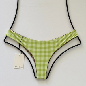 Angled view of Acacia Swimwear Ho’okipa Bikini Bottom in Stevie green gingham check, low-rise hipster fit with cheeky Brazilian back coverage.