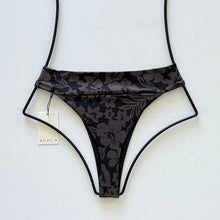 Back view of Acacia Swimwear Mateo bikini bottom showing cheeky high-leg cut and tropical floral design.