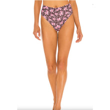 Model wearing Acacia Echo bikini bottom in Madonna print – high waist, cheeky cut with tropical floral print.