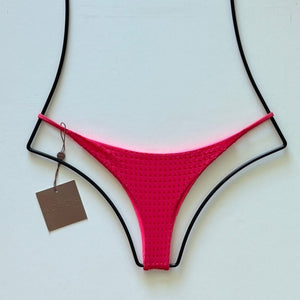 Flat lay of Acacia Swimwear Find Mesh Bikini Bottom in bright Fruit Punch pink with textured mesh overlay, size small.