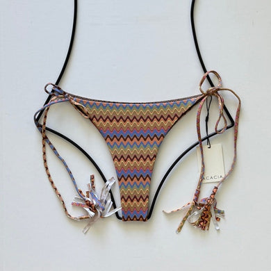 Acacia Swimwear Lauie bikini bottom in Mada print – multicolor retro zigzag pattern with tassel side ties, displayed flat with tags.