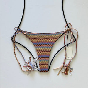 Acacia Swimwear Lauie bikini bottom in Mada print – multicolor retro zigzag pattern with tassel side ties, displayed flat with tags.