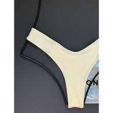 Close-up of OneOne Swimwear Heidi Skimpy Bottom in ivory ribbed fabric and texture with original tags
