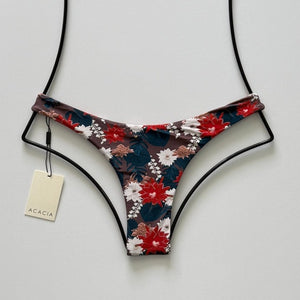 Front flat lay of Acacia Swimwear Oslo Bikini Bottom in Buket featuring brown base with red, teal, ivory, and tan floral print.