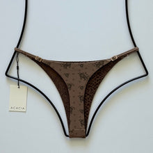 Back view of Acacia Ralphy bottom showing floral print and tonal animal-print inner lining detail.