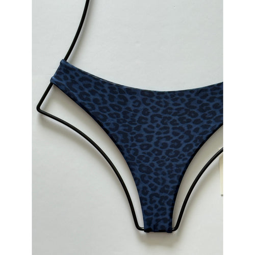 Close-up detail of Acacia Swimwear Blue Amur bikini bottom fabric and cut.
