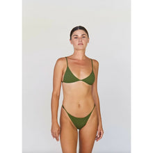 Model wearing Acacia Swimwear Neema Ribbed Bikini Bottom in Basil green, size large, with matching bikini top