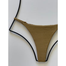 Close-up detail of ribbed texture and adjustable strap hardware on Acacia Swimwear Ralphy Bottom.