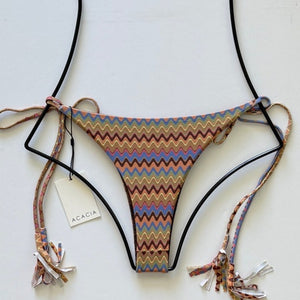 Back view of Acacia Swimwear Lauie bikini bottom in Mada print, showcasing cheeky cut and adjustable tassel tie sides.