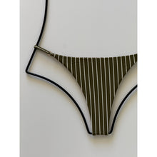 Detail view of Acacia Ralphy bikini bottom showing olive pinstripe fabric and matte adjustable hardware