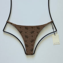 Front flat lay of Acacia Swimwear Ralphy Bikini Bottom in Aimi – mocha brown with floral microprint and Acacia tag visible.